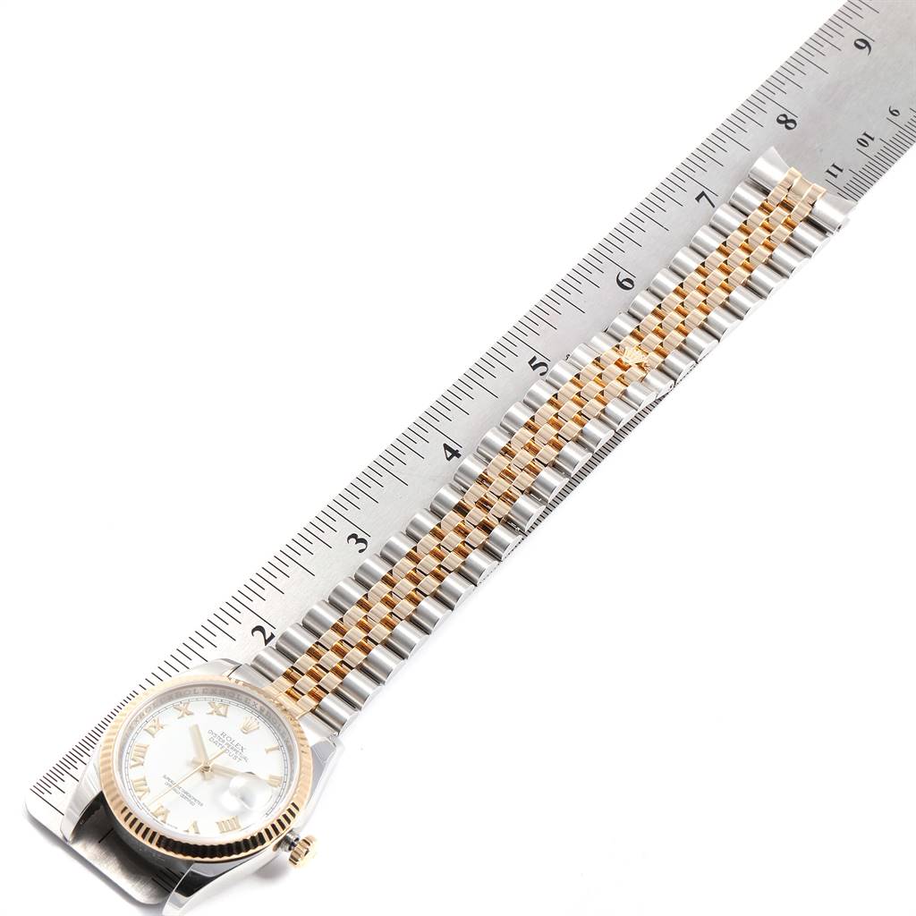 This image shows a Rolex Datejust 116233 Men's Stainless Steel White Dial 116233 Men's Stainless Steel White Dial watch placed flat, with the face and full length of the bracelet visible alongside a ruler.