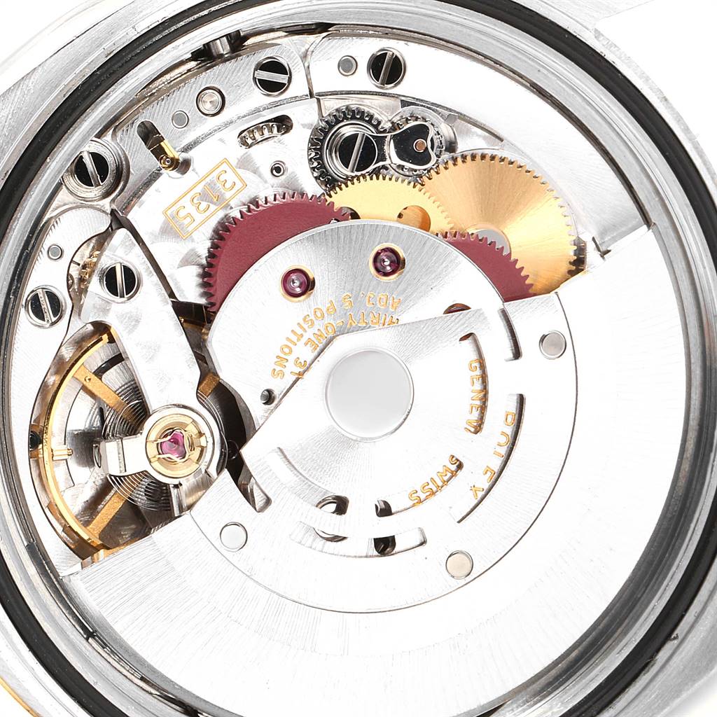 The image shows the mechanical movement of a Rolex Datejust 116233 Men's Stainless Steel White Dial 116233 Men's Stainless Steel White Dial watch, viewed from the back.