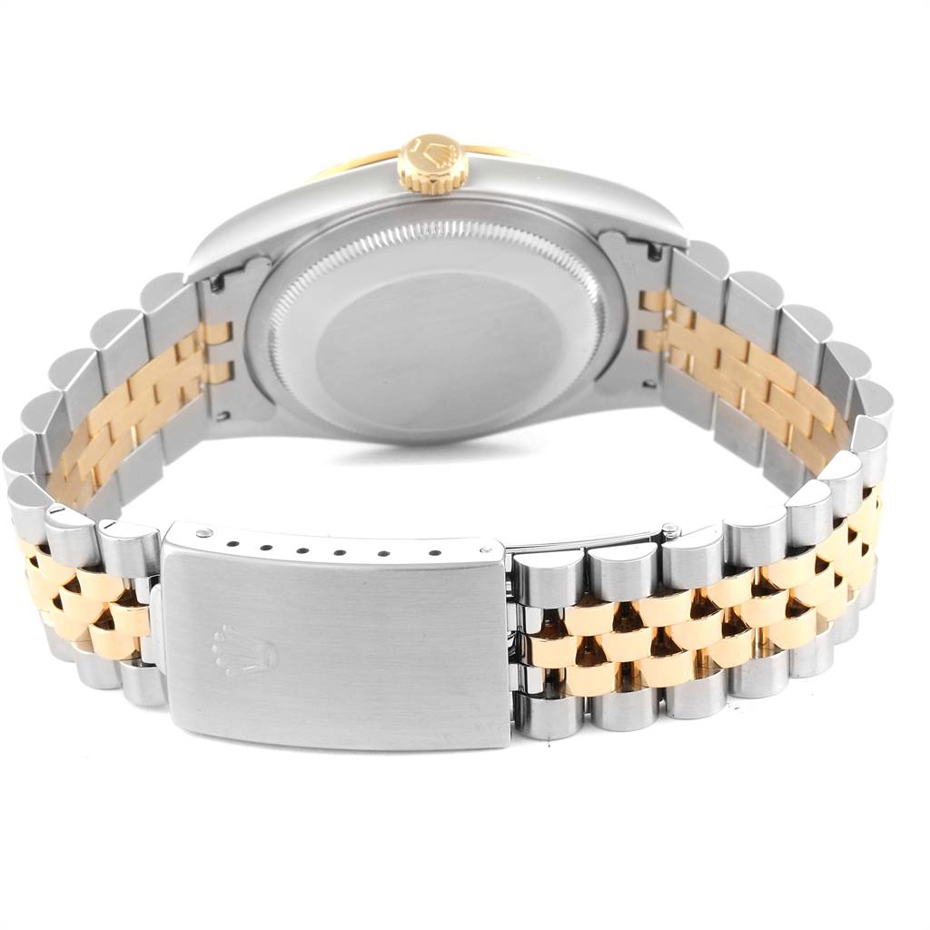 The image shows the back of a Rolex Datejust 16233 Men's Steel and Gold (two tone) Beige Dial 16233 Men's Steel and Gold (two tone) Beige Dial watch, highlighting its two-tone bracelet and clasp.