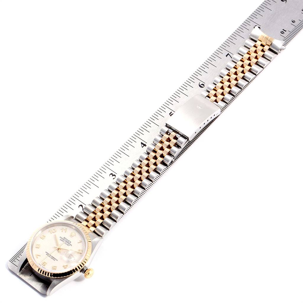 The image shows a Rolex Datejust 16233 Men's Steel and Gold (two tone) Beige Dial 16233 Men's Steel and Gold (two tone) Beige Dial watch laid flat, with the face and bracelet fully visible, measured against a ruler.