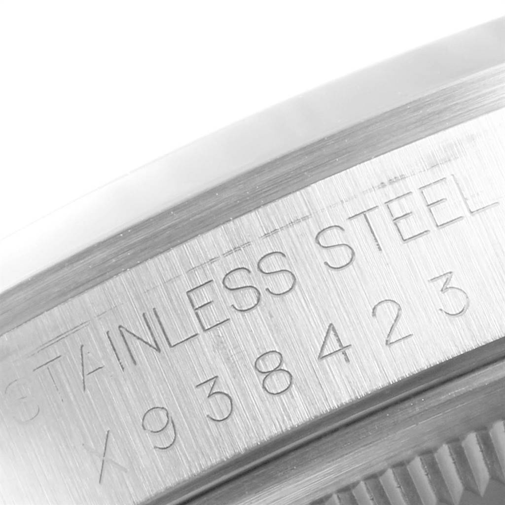 This close-up image shows the side engraving on the stainless steel casing of the Rolex Datejust 16200 Men's Stainless Steel White Dial 16200 Men's Stainless Steel White Dial model watch.