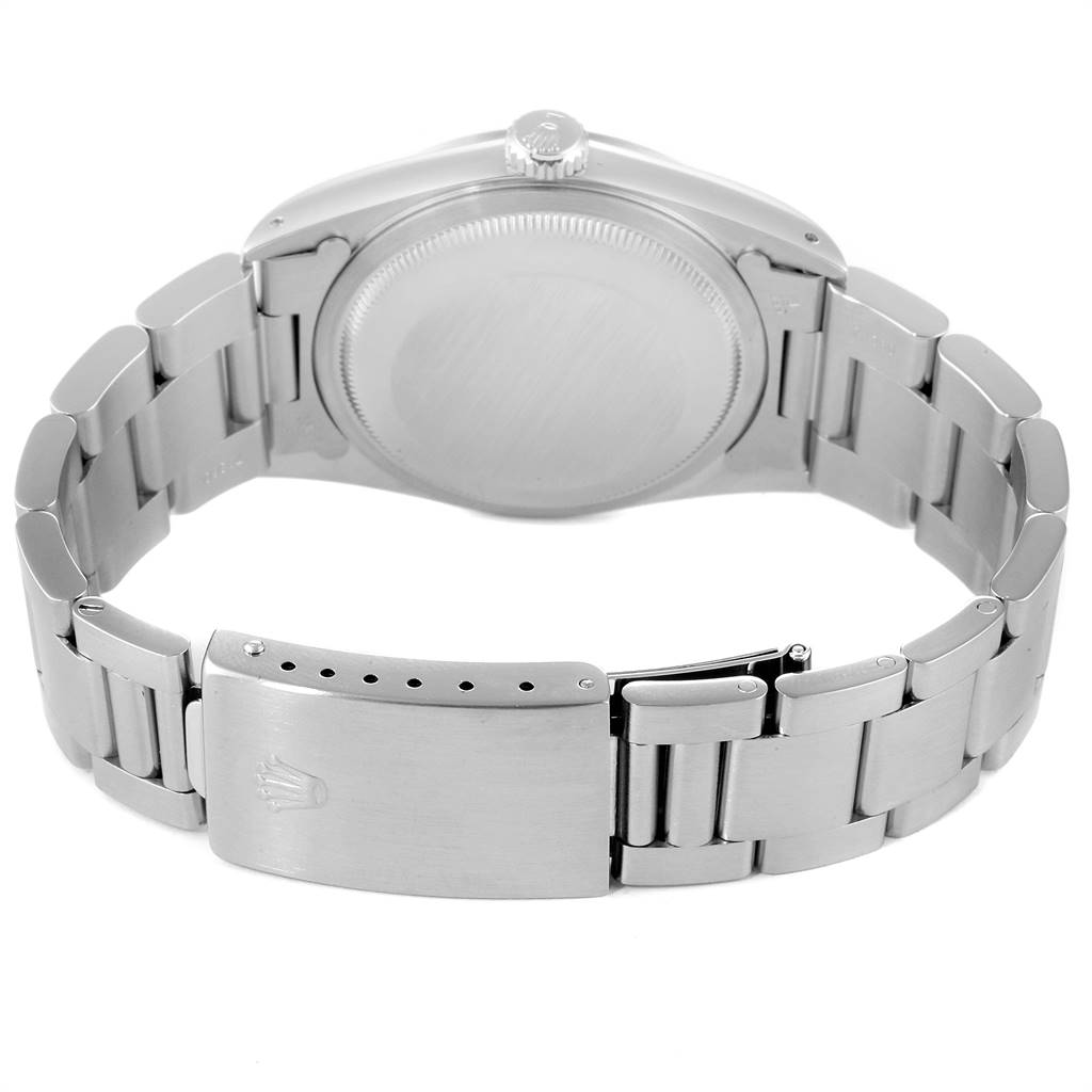 The image shows the back of a Rolex Datejust 16200 Men's Stainless Steel White Dial 16200 Men's Stainless Steel White Dial watch, focusing on the case back, crown, and metal bracelet with a clasp.