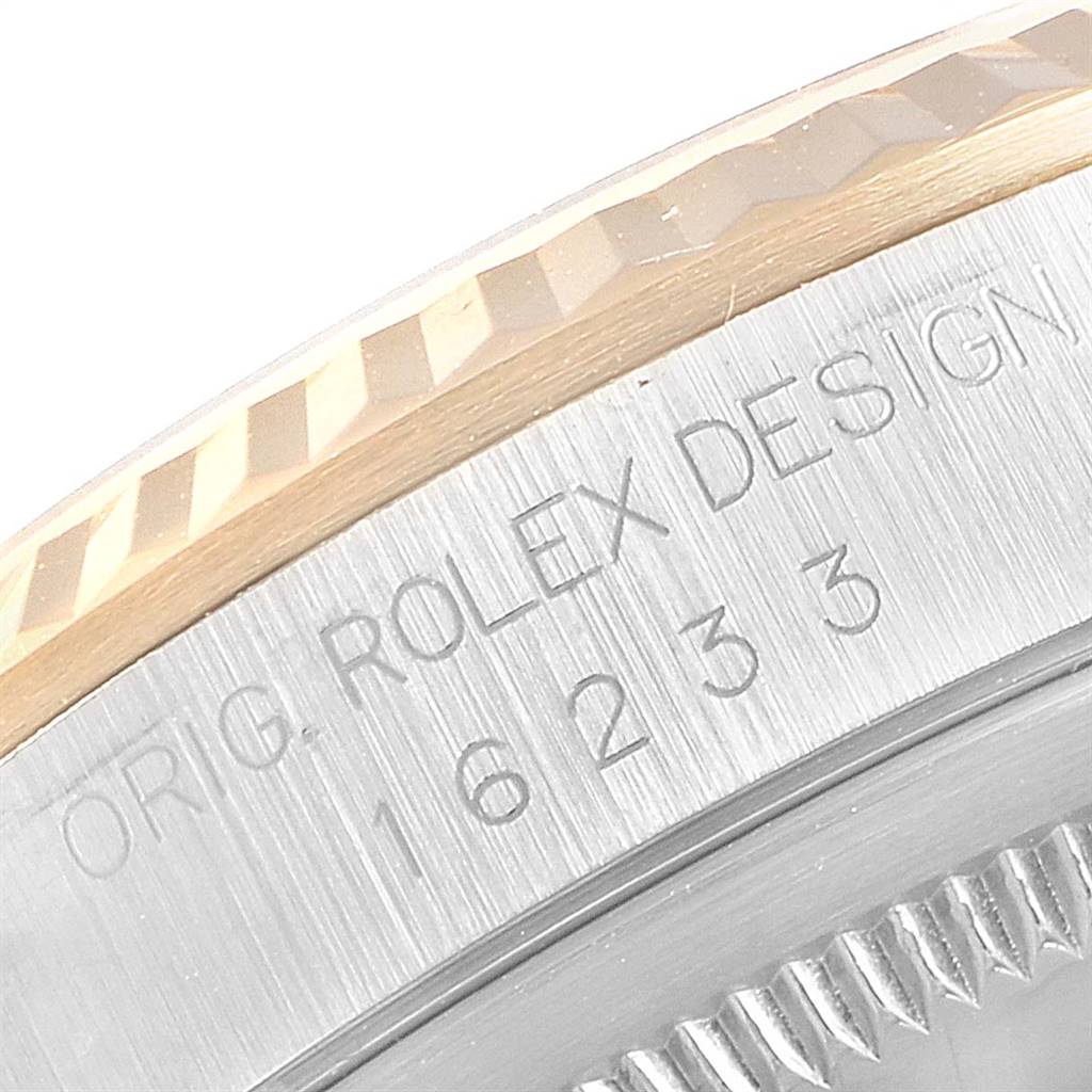 This image shows a close-up of the bezel and case with the engraved model number on a Rolex Datejust 16233 Men
s Steel and Gold (two tone) Silver Dial 16233 Men
s Steel and Gold (two tone) Silver Dial watch.