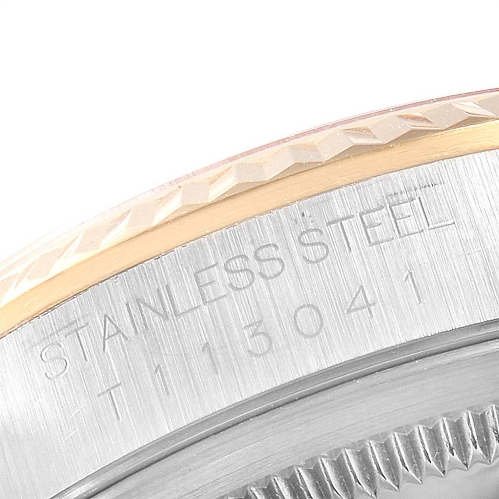 This is a close-up shot showing the side and engravings of a Rolex Datejust 16233 Men
s Steel and Gold (two tone) Silver Dial 16233 Men
s Steel and Gold (two tone) Silver Dial watch bezel.