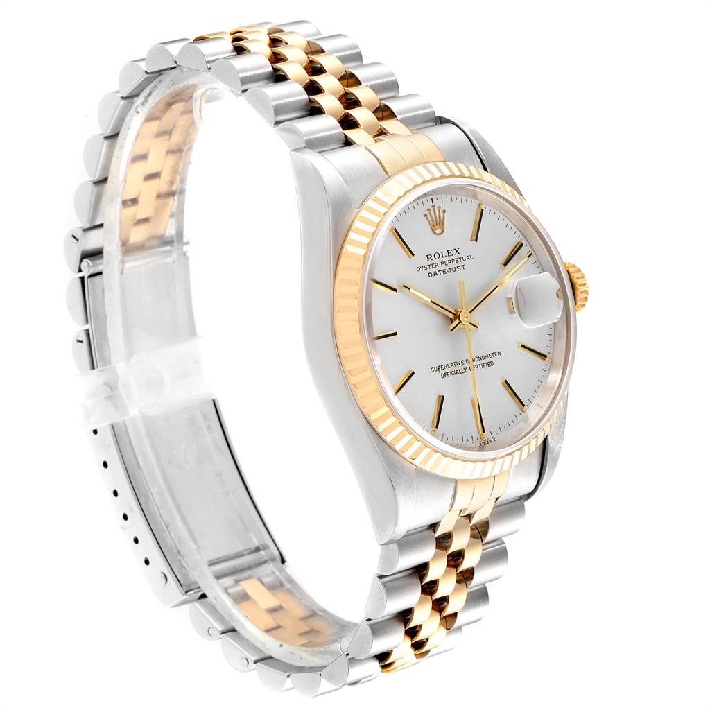 This image shows a side and front angle of a Rolex Datejust 16233 Men
s Steel and Gold (two tone) Silver Dial 16233 Men
s Steel and Gold (two tone) Silver Dial watch highlighting the face, fluted bezel, and two-tone Jubilee bracelet.