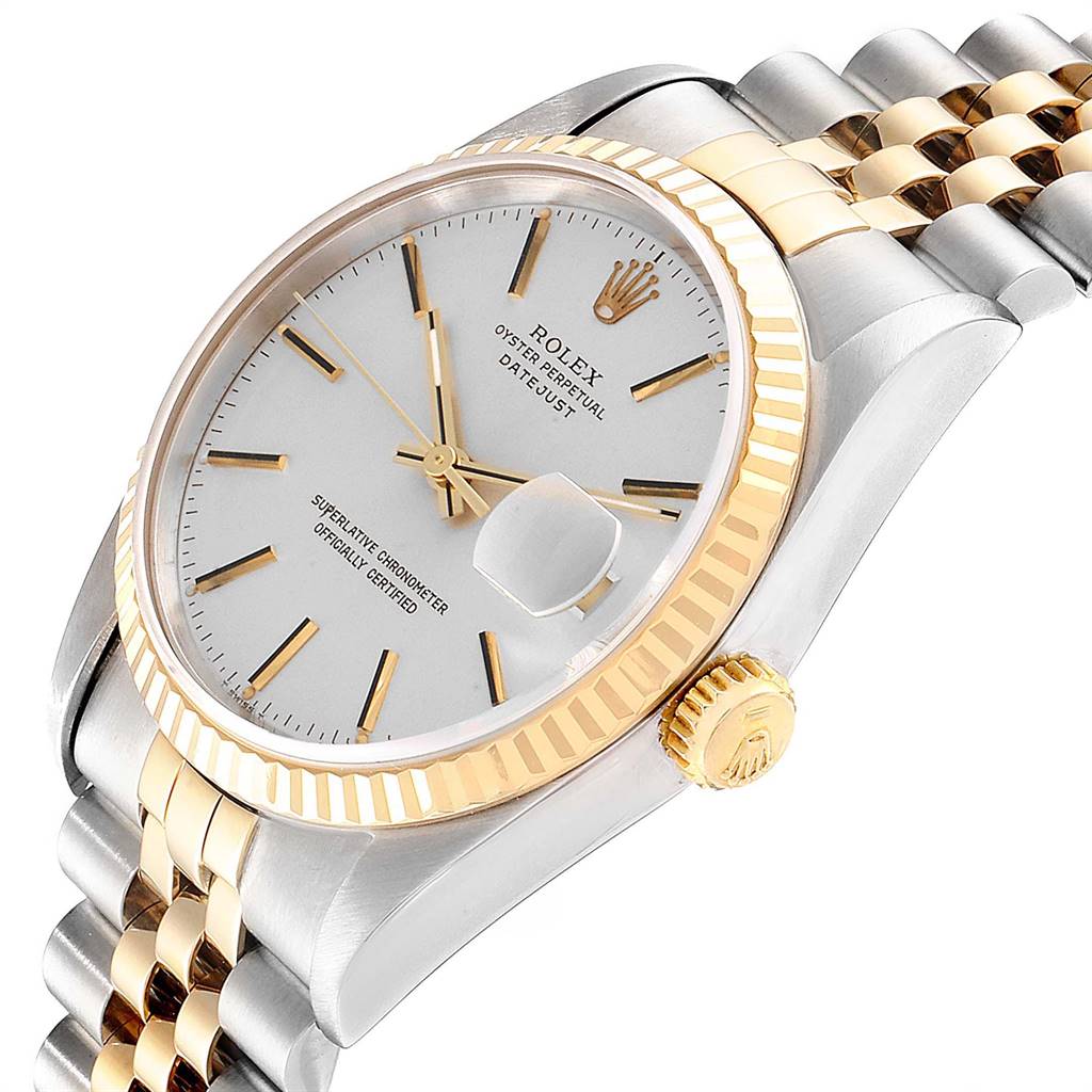 This image shows a close-up angle of a Rolex Datejust 16233 Men
s Steel and Gold (two tone) Silver Dial 16233 Men
s Steel and Gold (two tone) Silver Dial watch, highlighting its dial, bezel, and part of the bracelet.