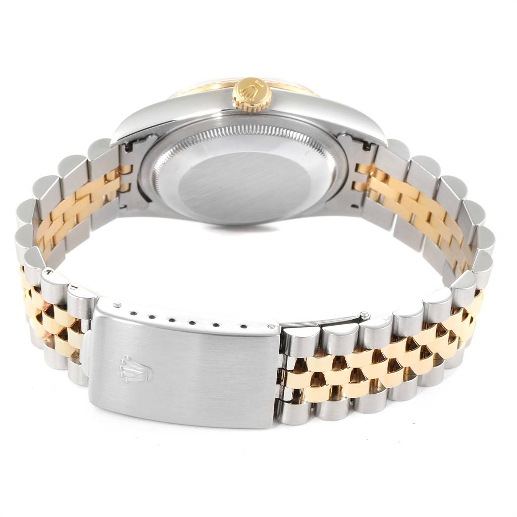 The Rolex Datejust 16233 Men
s Steel and Gold (two tone) Silver Dial 16233 Men
s Steel and Gold (two tone) Silver Dial watch is shown from the back, displaying the case back, crown, and two-tone metal bracelet with clasp.