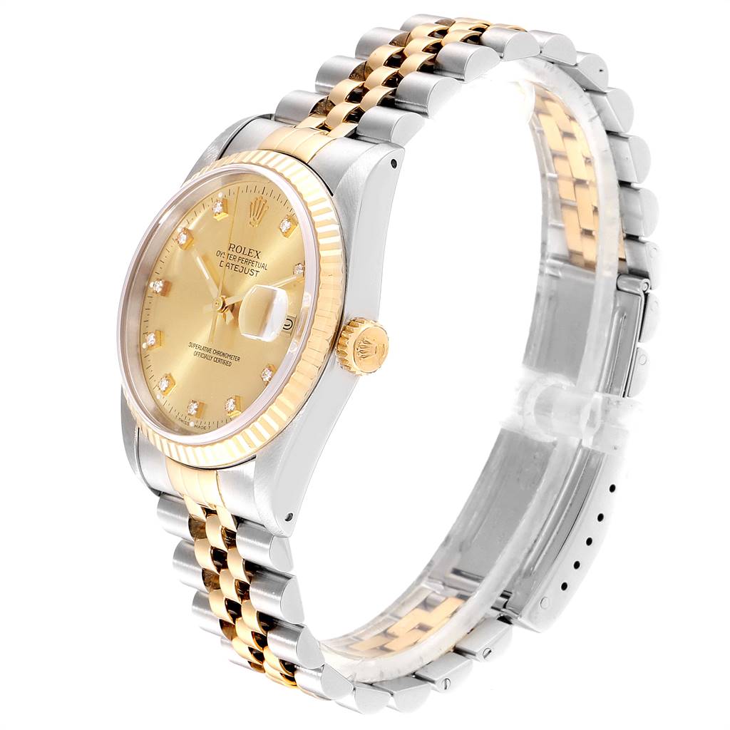 This Rolex Datejust 16233 Men's Steel and Gold (two tone) Champagne Dial 16233 Men's Steel and Gold (two tone) Champagne Dial watch is shown at a three-quarters angle, displaying its gold dial, fluted bezel, and two-tone bracelet.