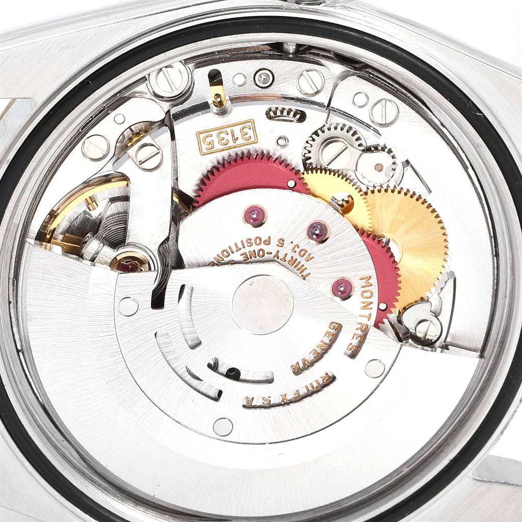 The image shows the internal mechanism and movement of a Rolex Datejust 16233 Men
s Steel and Gold (two tone) Black Dial 16233 Men
s Steel and Gold (two tone) Black Dial watch, taken from the back.