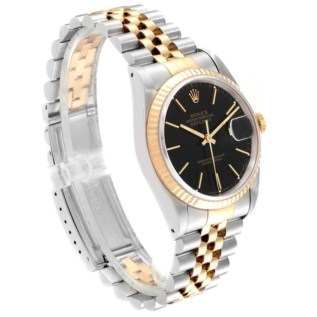 The Rolex Datejust 16233 Men
s Steel and Gold (two tone) Black Dial 16233 Men
s Steel and Gold (two tone) Black Dial watch is shown at a slight angle, highlighting its black dial, gold bezel, and two-tone bracelet.