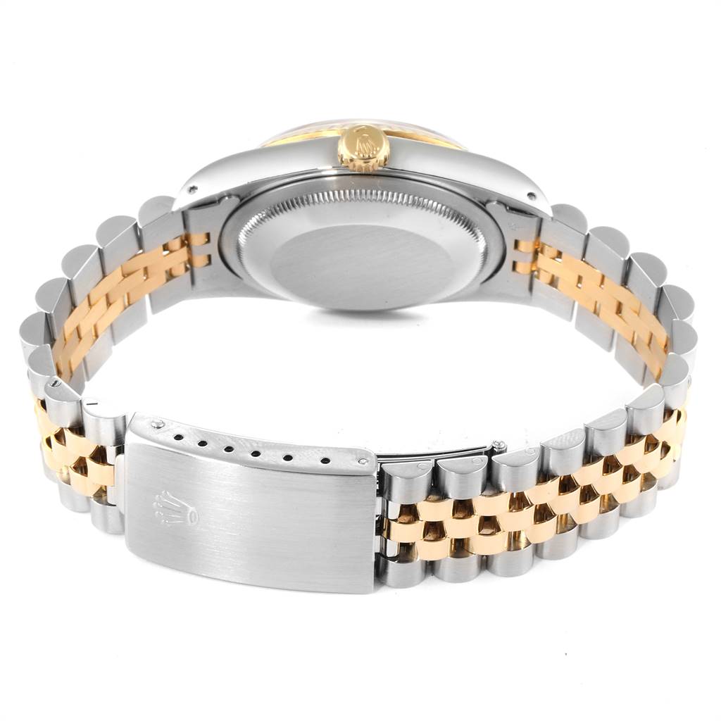 This image shows the back view of a Rolex Datejust 16233 Men
s Steel and Gold (two tone) Black Dial 16233 Men
s Steel and Gold (two tone) Black Dial watch, highlighting its two-tone bracelet and closed clasp.