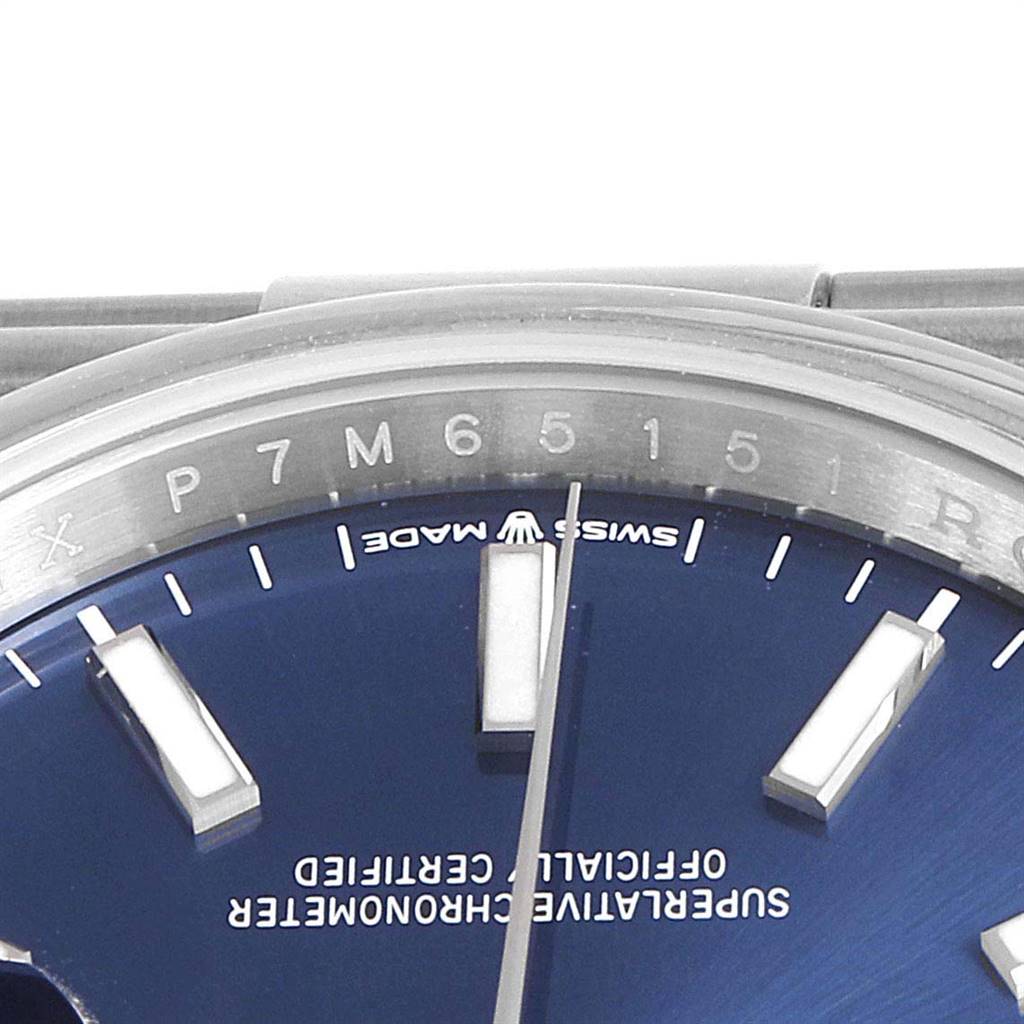 This image shows a close-up of the dial and part of the bezel of a Rolex Datejust 126200 Men's Stainless Steel Blue Dial 126200 Men's Stainless Steel Blue Dial watch, highlighting the markers and "Swiss Made" text.