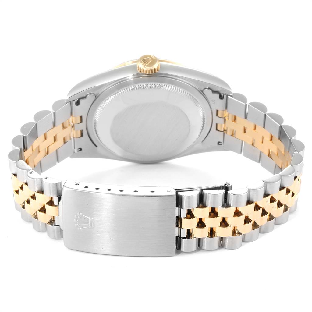 The image shows the back view of a Rolex Datejust 16233 Men's Steel and Gold (two tone) Champagne Dial 16233 Men's Steel and Gold (two tone) Champagne Dial model, highlighting the case back, crown, and Jubilee bracelet with clasp.