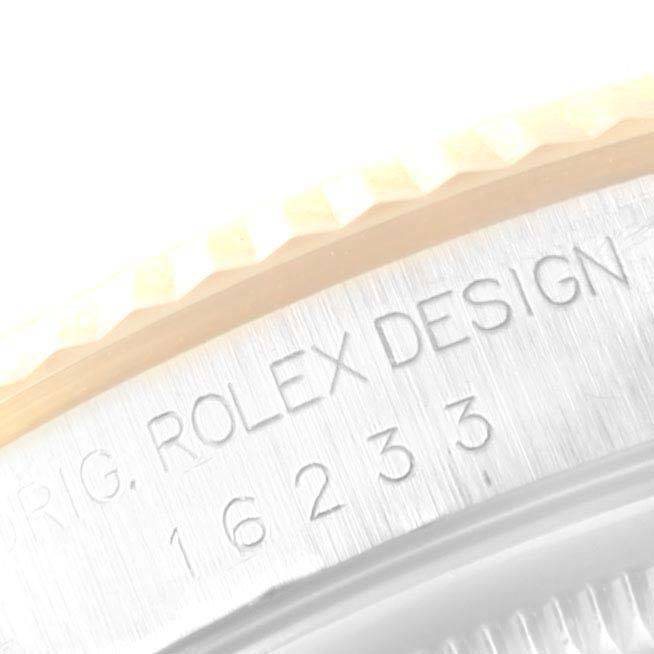This image shows a close-up of the engraved side of the casing on a Rolex Datejust 16233 Men's Steel and Gold (two tone) Champagne Dial 16233 Men's Steel and Gold (two tone) Champagne Dial model watch.