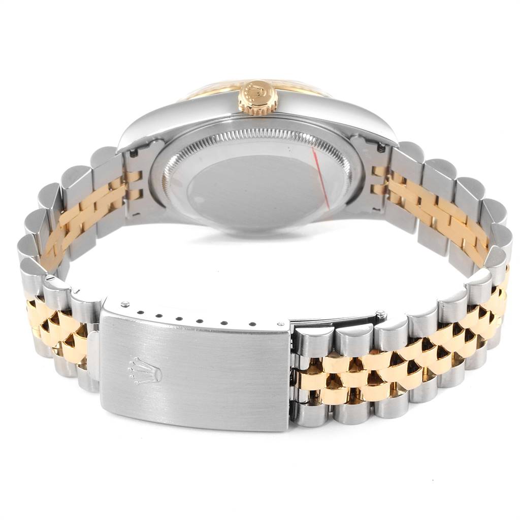 The Rolex Datejust 16233 Men
s Steel and Gold (two tone) Champagne Dial 16233 Men
s Steel and Gold (two tone) Champagne Dial watch is shown from the back, highlighting the case back, crown, and two-tone Jubilee bracelet.