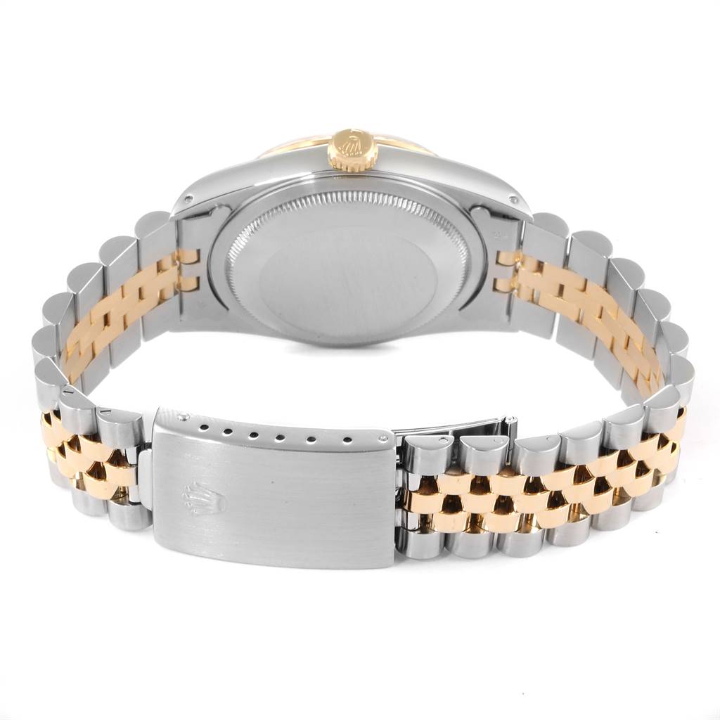 The image shows the back of a Rolex Datejust 16233 Men
s Steel and Gold (two tone) Champagne Dial 16233 Men
s Steel and Gold (two tone) Champagne Dial watch, highlighting the case back, crown, and two-tone Jubilee bracelet with the clasp.