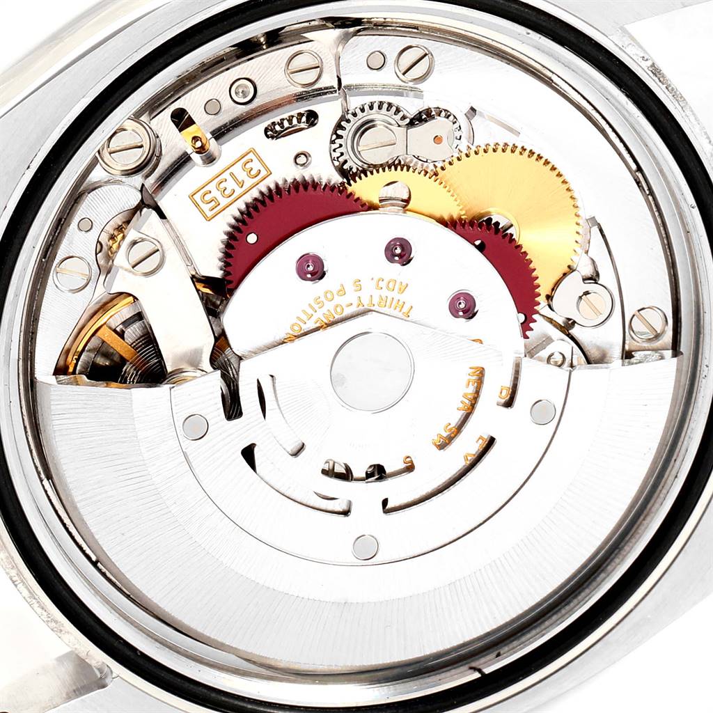 This image shows a close-up view of the movement and inner mechanisms of a Rolex Datejust 116234 Men's Stainless Steel Silver Dial 116234 Men's Stainless Steel Silver Dial watch.