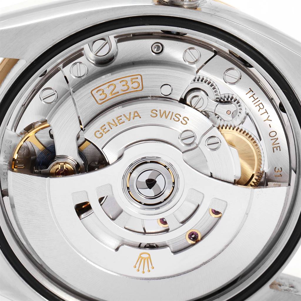 This image shows a close-up of the movement mechanism on a Rolex Datejust 126233 Men's Steel and Gold (two tone) Champagne Dial 126233 Men's Steel and Gold (two tone) Champagne Dial watch.