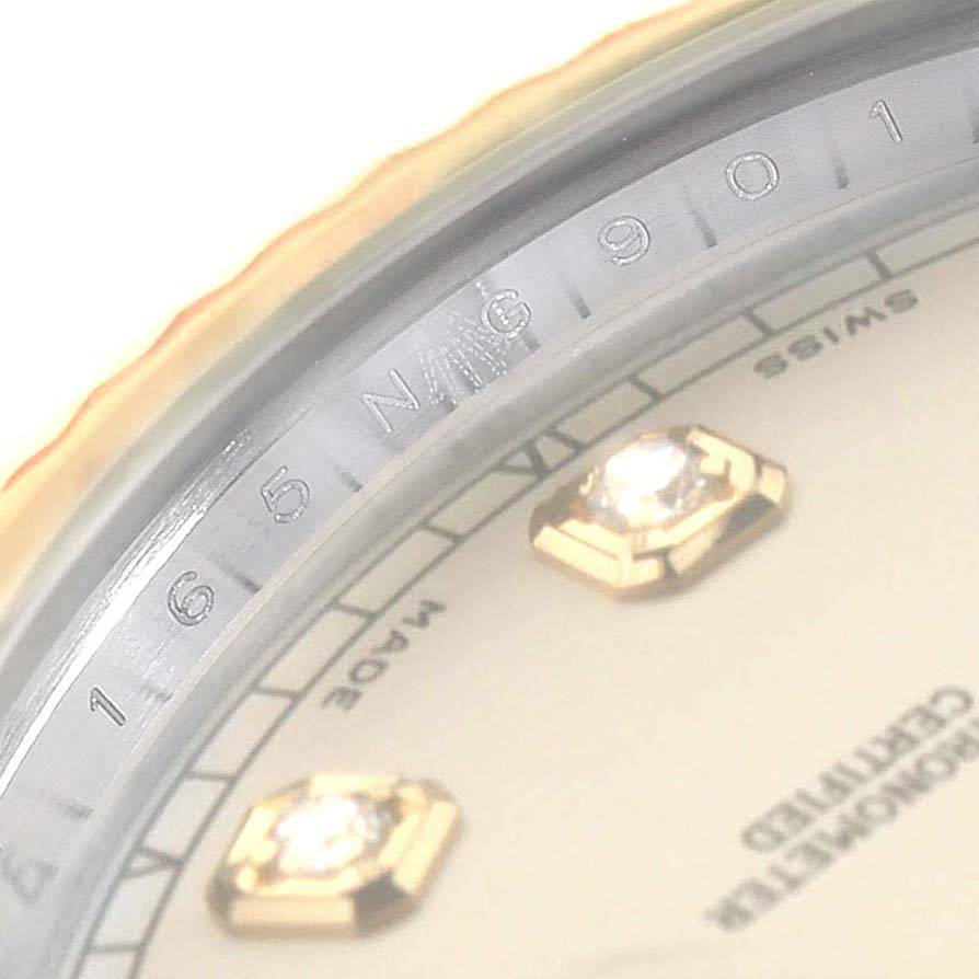 This is a close-up view of the Rolex Datejust 116333 Men's Steel and Gold (two tone) Silver Dial 116333 Men's Steel and Gold (two tone) Silver Dial watch, showing the chapter ring with serial numbers and part of the dial.