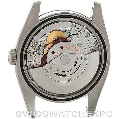 The image shows the back view of a Rolex Datejust 116200 Men's Stainless Steel Black Dial 116200 Men's Stainless Steel Black Dial watch, featuring its intricate internal movement mechanism.