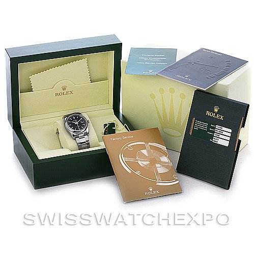 The image shows a Rolex Datejust 116200 Men's Stainless Steel Black Dial 116200 Men's Stainless Steel Black Dial watch in its box, along with manuals, a cleaning cloth, and guarantee card.