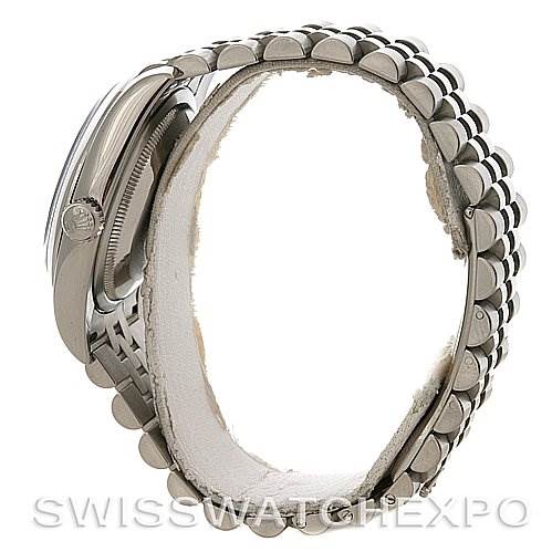 This image shows a side view of a Rolex Datejust 116200-BKRJ Men
s Stainless Steel Black Dial 116200-BKRJ Men
s Stainless Steel Black Dial model, focusing on the bezel, part of the bracelet, and the crown.