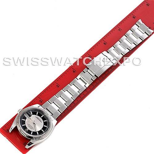 The Rolex Datejust 116234BKRSJ Men's Stainless Steel Silver Dial 116234BKRSJ Men's Stainless Steel Silver Dial watch is shown from a top-down angle, displaying the face, bezel, bracelet, and clasp along a red ruler.