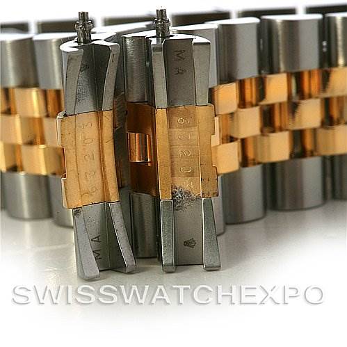 The image shows the Oystersteel and yellow gold bracelet links of a Rolex Datejust 116203 Men's Stainless Steel Black Dial 116203 Men's Stainless Steel Black Dial watch, viewed from a close angle.