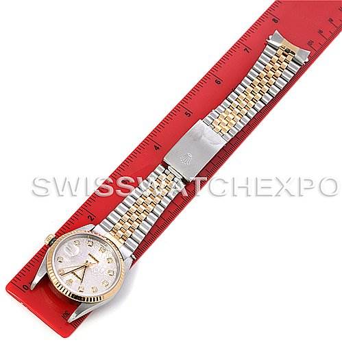 The image shows a Rolex Datejust 16233 Men's Steel and Gold (two tone) Silver Dial 16233 Men's Steel and Gold (two tone) Silver Dial watch laid flat, displaying the face, bezel, and full length of the Jubilee bracelet next to a ruler for scale.