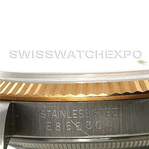 This image shows a close-up side view of the case and bezel of a Rolex Datejust 16233 Men's Steel and Gold (two tone) Black Dial 16233 Men's Steel and Gold (two tone) Black Dial watch, highlighting the stainless steel and its serial number.