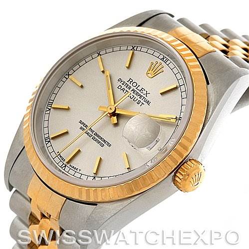 The image shows a close-up view of a Rolex Datejust 16233 Men's Steel and Gold (two tone) Silver Dial 16233 Men's Steel and Gold (two tone) Silver Dial watch, highlighting its dial, bezel, crown, and part of the bracelet.