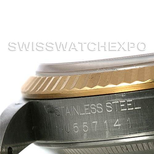 This close-up image shows the stainless steel side of the Rolex Datejust 16233 Men's Steel and Gold (two tone) Silver Dial 16233 Men's Steel and Gold (two tone) Silver Dial with part of the bezel and engraving visible.