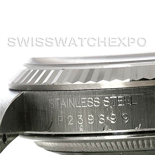 This close-up image shows the side view of the case and bezel of a Rolex Datejust 16234 Men's Stainless Steel Silver Dial 16234 Men's Stainless Steel Silver Dial watch, highlighting the engraved serial number.