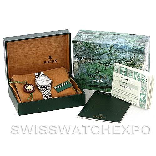 The image shows a Rolex Datejust 16234 Men's Stainless Steel Silver Dial 16234 Men's Stainless Steel Silver Dial watch with its box, tags, and accompanying booklets.