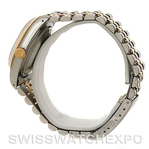 The image shows a side view of a Rolex Datejust 16233 Men's Steel and Gold (two tone) Champagne Dial 16233 Men's Steel and Gold (two tone) Champagne Dial watch, highlighting its two-tone metal bracelet and partially visible case with the crown.