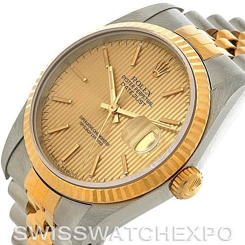 This Rolex Datejust 16233 Men's Steel and Gold (two tone) Champagne Dial 16233 Men's Steel and Gold (two tone) Champagne Dial watch is shown at a slight angle, highlighting the dial, fluted bezel, crown, and bracelet.