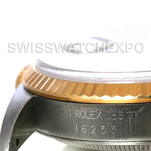 This image shows a close-up of the case's side of a Rolex Datejust 16233 Men's Steel and Gold (two tone) White Dial 16233 Men's Steel and Gold (two tone) White Dial model, highlighting the serial number and the fluted bezel.