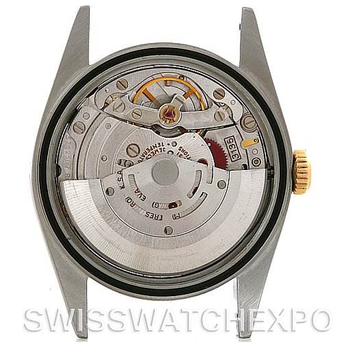 The image shows an internal view of the Rolex Datejust 16233 Men's Steel and Gold (two tone) White Dial 16233 Men's Steel and Gold (two tone) White Dial watch, specifically its movement and mechanical components, seen from the case back.