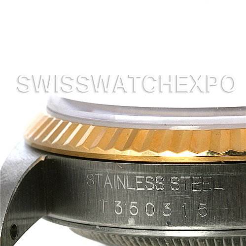 A close-up image showing the side view of a Rolex Datejust 16233 Men's Steel and Gold (two tone) Champagne Dial 16233 Men's Steel and Gold (two tone) Champagne Dial's stainless steel case, model number, and the fluted bezel.