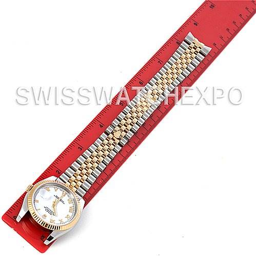 The image shows a Rolex Datejust 116233 Men's Stainless Steel White Dial 116233 Men's Stainless Steel White Dial watch laid flat alongside a red ruler, displaying the watch head and bracelet.