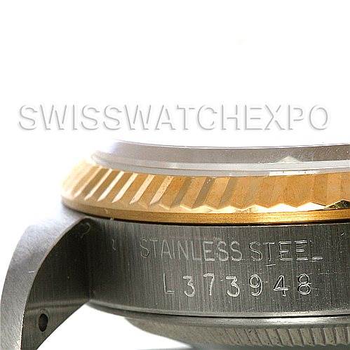 The image shows a close-up of the case and bezel of a Rolex Datejust 16233 Men's Steel and Gold (two tone) Champagne Dial 16233 Men's Steel and Gold (two tone) Champagne Dial watch, highlighting the stainless steel engraving and part of the serial number.
