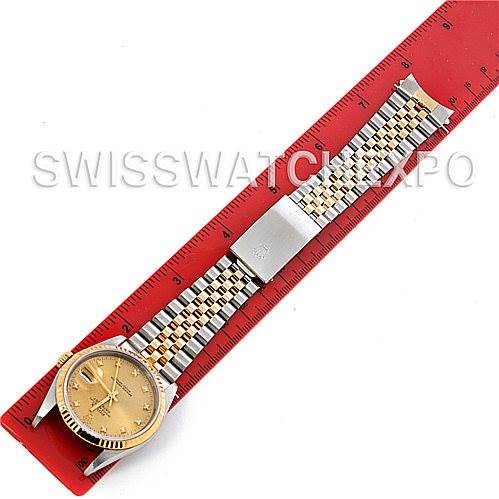 The Rolex Datejust 16233 Men's Steel and Gold (two tone) Champagne Dial 16233 Men's Steel and Gold (two tone) Champagne Dial watch is shown from an overhead angle, displaying the face, bezel, and bracelet.