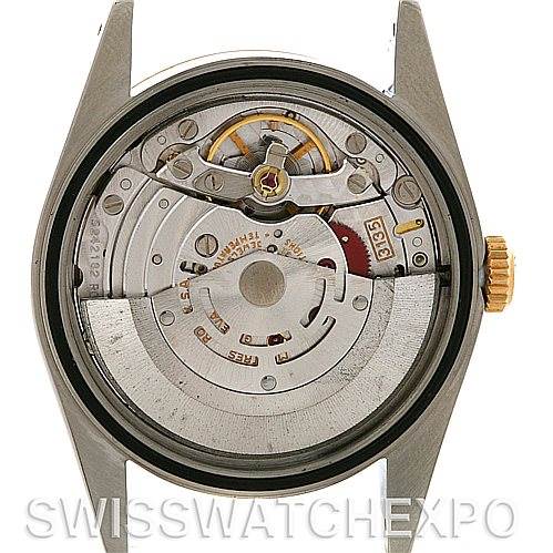 This image shows a Rolex Datejust 16233 Men's Steel and Gold (two tone) Champagne Dial 16233 Men's Steel and Gold (two tone) Champagne Dial watch from the back, revealing its intricate movement and inner mechanisms.