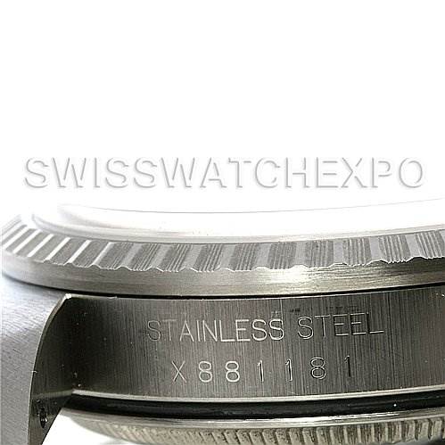 The image shows a close-up of the case and bezel of a Rolex Datejust 16220 Men's Stainless Steel Silver Dial 16220 Men's Stainless Steel Silver Dial, with "Stainless Steel" and a serial number engraved.