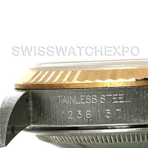 The image shows a close-up side view of a Rolex Datejust 16233 Men's Steel and Gold (two tone) Beige Dial 16233 Men's Steel and Gold (two tone) Beige Dial watch case, highlighting the stainless steel engraving and fluted bezel.