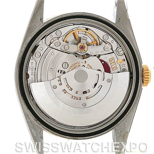 The image shows the internal movement mechanism of a Rolex Datejust 16233 Men's Steel and Gold (two tone) Beige Dial 16233 Men's Steel and Gold (two tone) Beige Dial watch from a back angle with the case back removed.