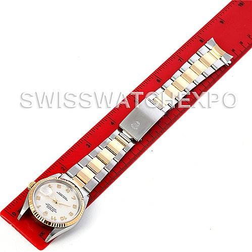 The Rolex Datejust 16233 Men's Steel and Gold (two tone) Beige Dial 16233 Men's Steel and Gold (two tone) Beige Dial watch is shown from a top-down angle, displaying the face, bracelet, and part of the clasp.