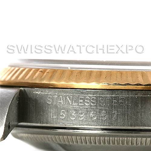 This is a close-up side view of a Rolex Datejust 16233 Men's Steel and Gold (two tone) Blue Dial 16233 Men's Steel and Gold (two tone) Blue Dial watch showing the stainless steel case and engraving.