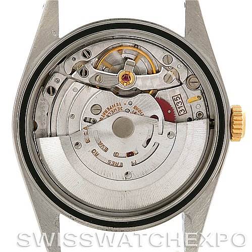 The image shows the Rolex Datejust 16233 Men's Steel and Gold (two tone) Blue Dial 16233 Men's Steel and Gold (two tone) Blue Dial watch from a back angle, highlighting its exposed movement and internal mechanisms.