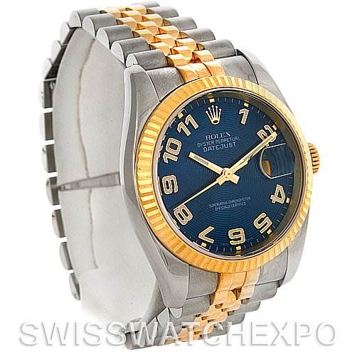 The image shows a side angle of a Rolex Datejust 116233 Men
s Stainless Steel Blue Dial 116233 Men
s Stainless Steel Blue Dial watch highlighting the blue dial, steel and gold jubilee bracelet, and fluted bezel.